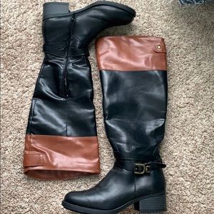 Brown and black riding boots, knee high